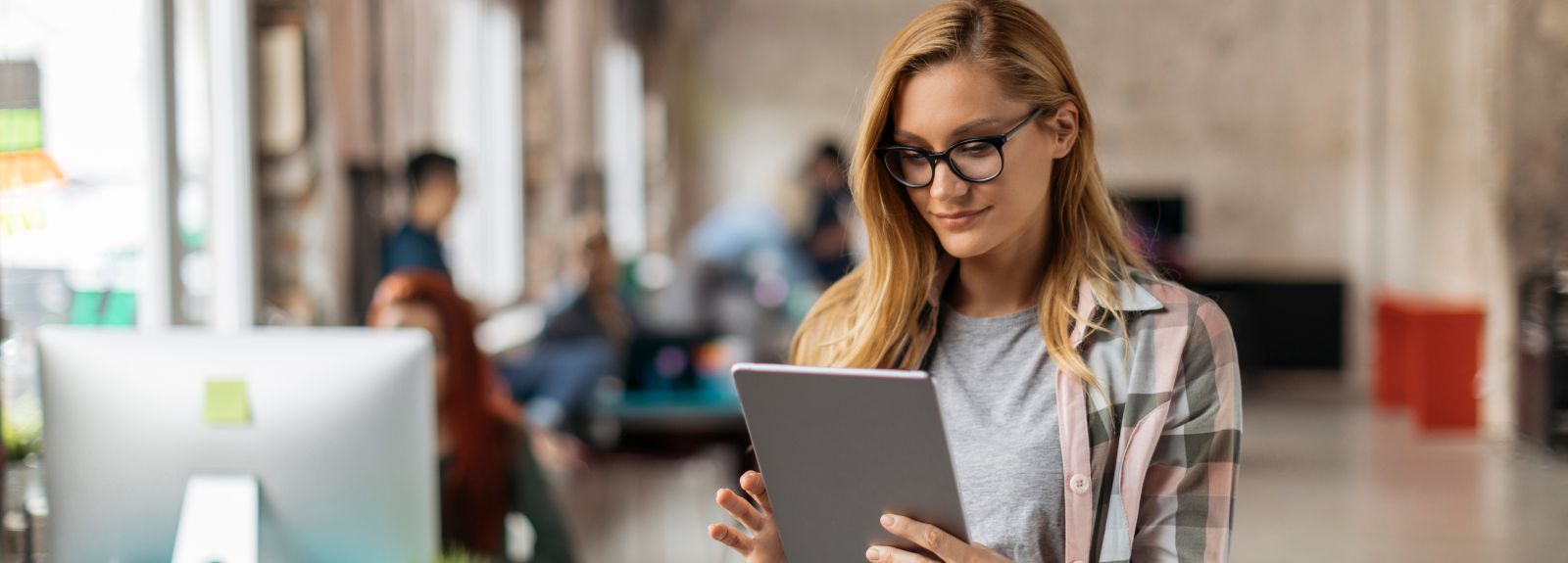 Lady looking up information on a tablet